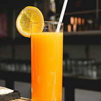 An image of a glass of orange juice